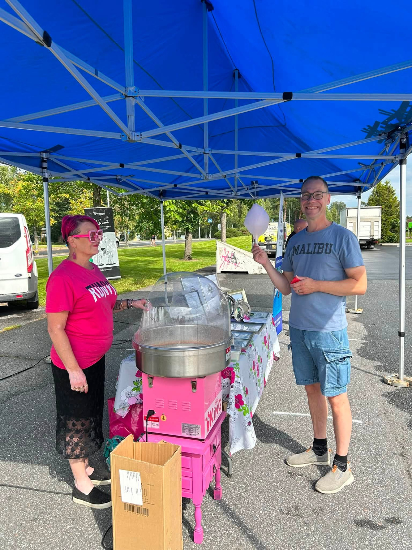 Volunteers serving refreshments at the association's stand during a summer event
